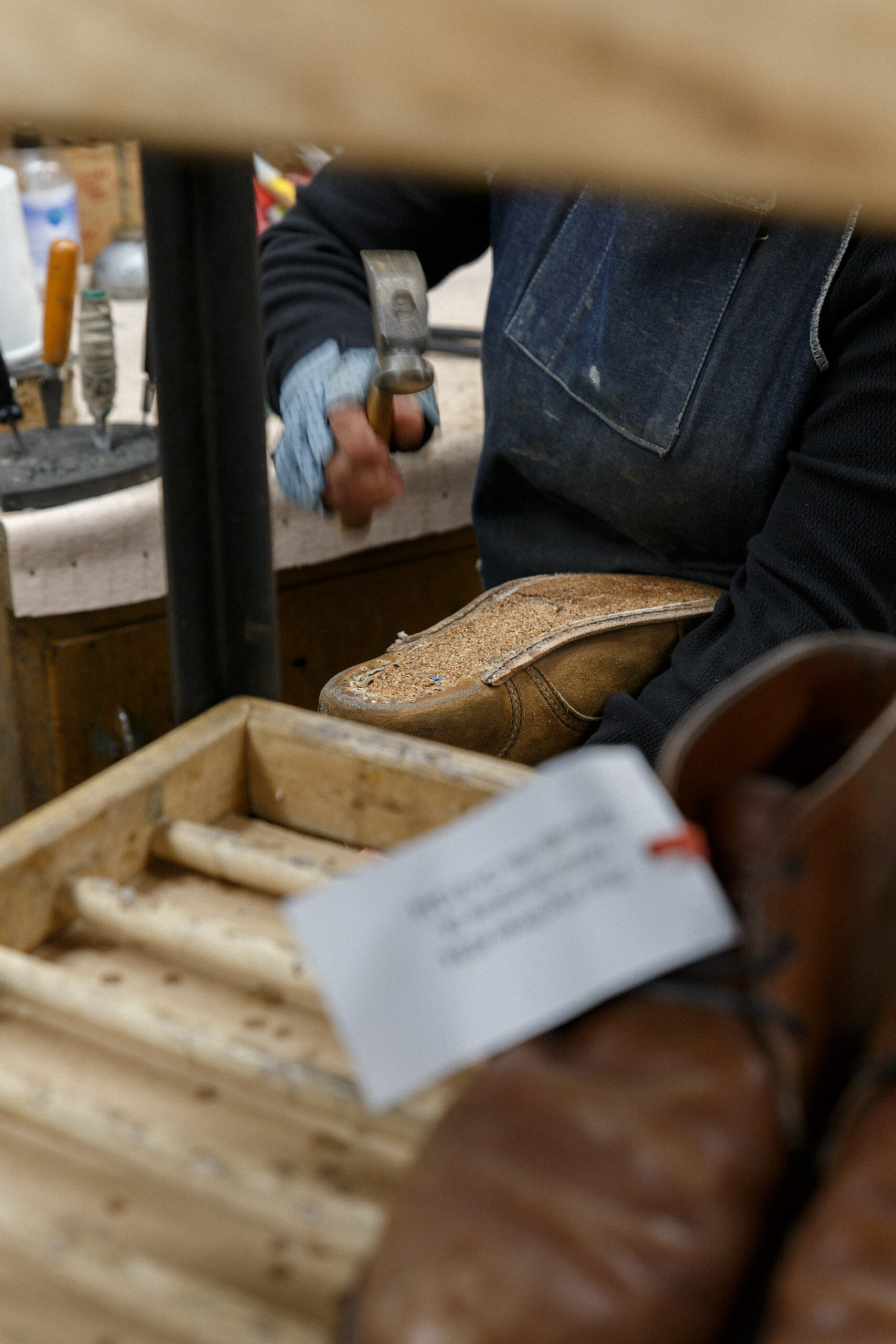 red wing shoes cobbler hammering